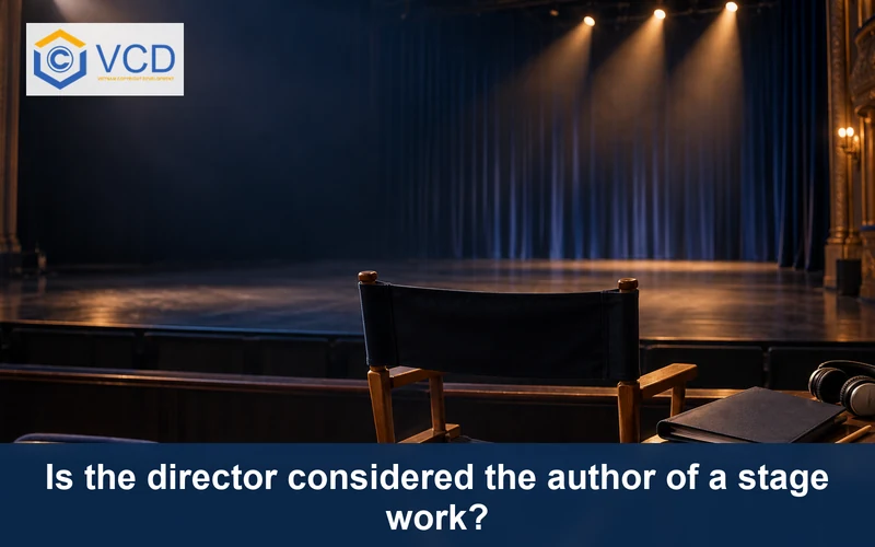 Director's chair, blank production binder and headphones facing an empty theatre stage
