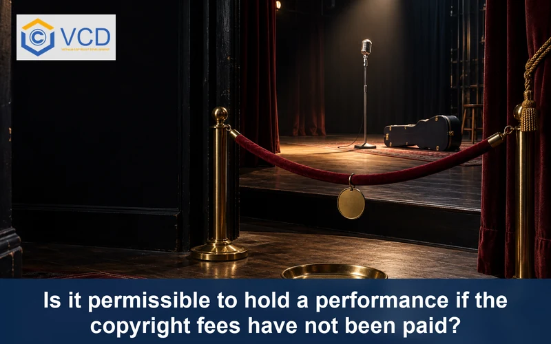 Closed theater stage blocked by a red barrier beside an empty copyright payment tray